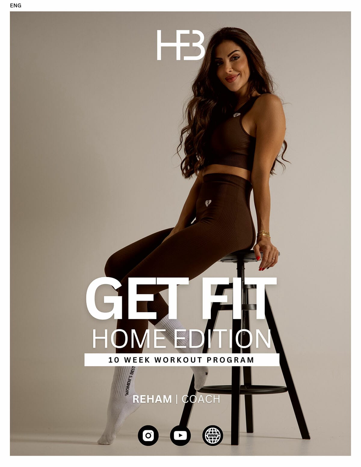 A woman sitting on a stool with the Get Fit Guide - Home Edition.